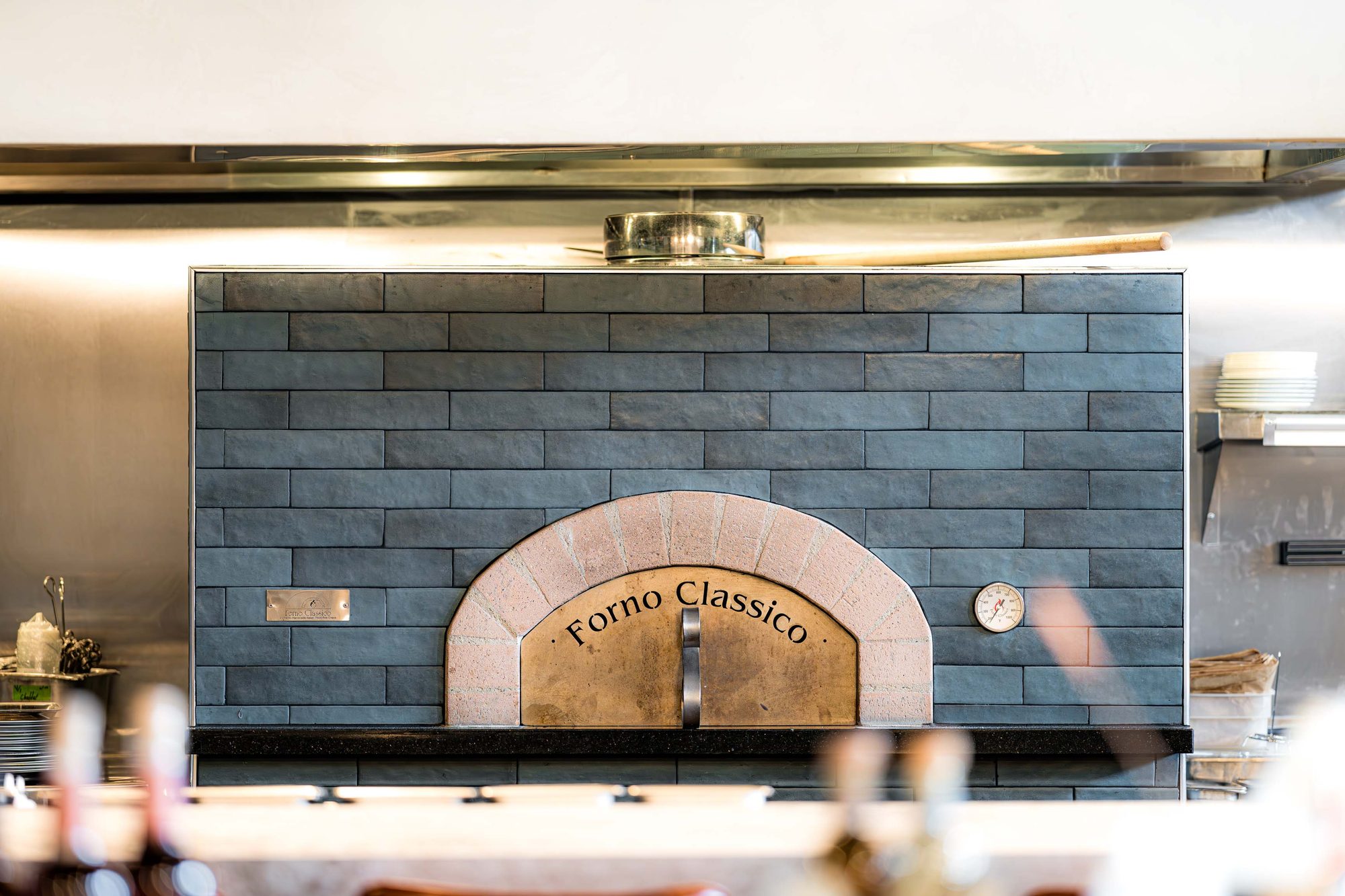 Wood-fired Forno Classico oven behind the Carmel chef's counter