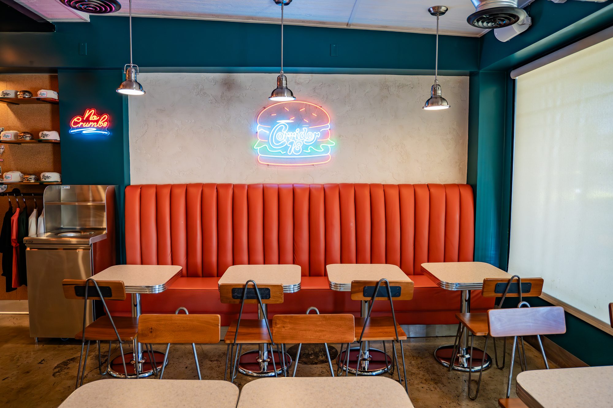 Row of orange booths along the Corridor 18 dining room