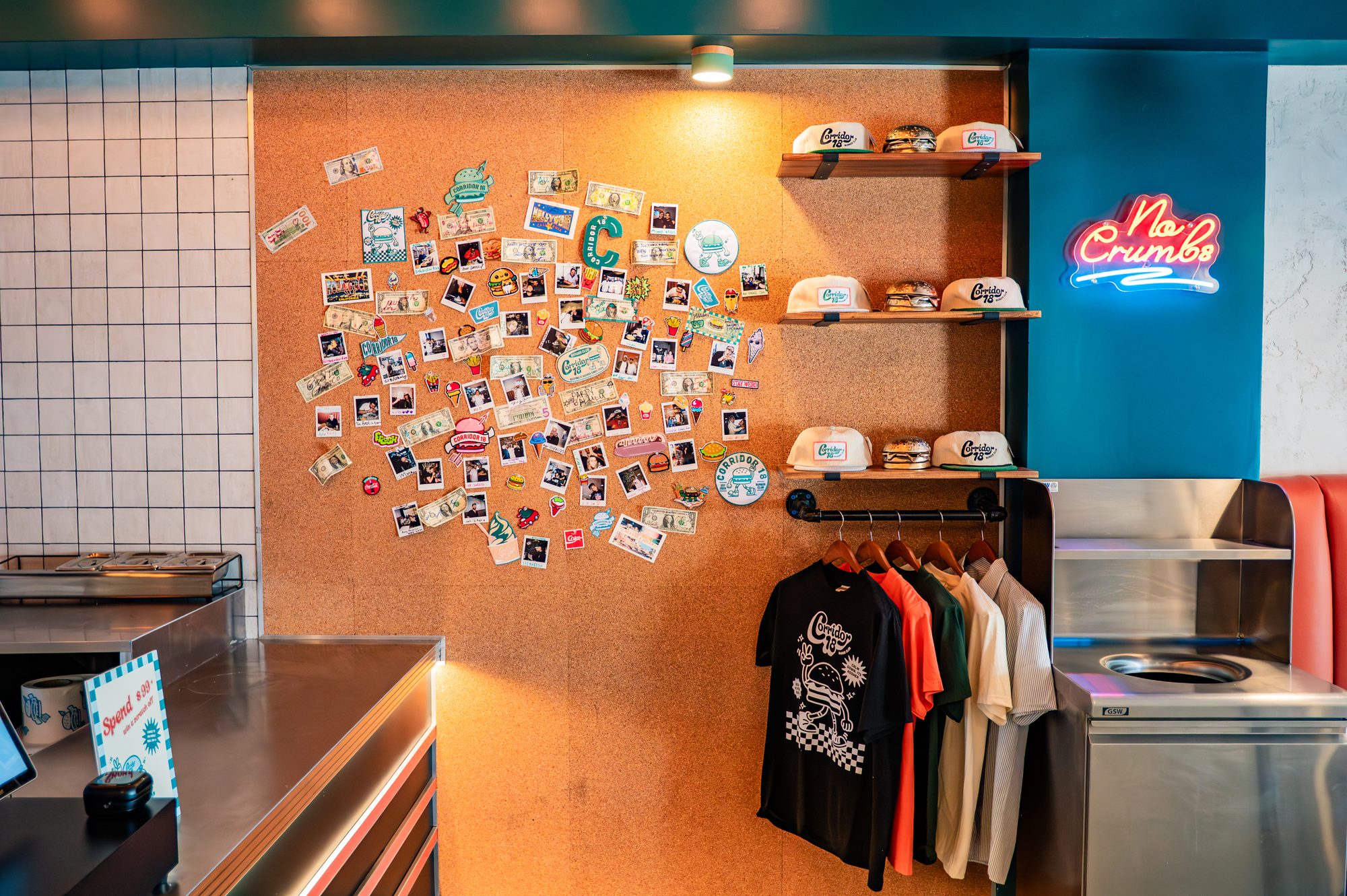 Merchandise display and neon logo wall at Corridor 18